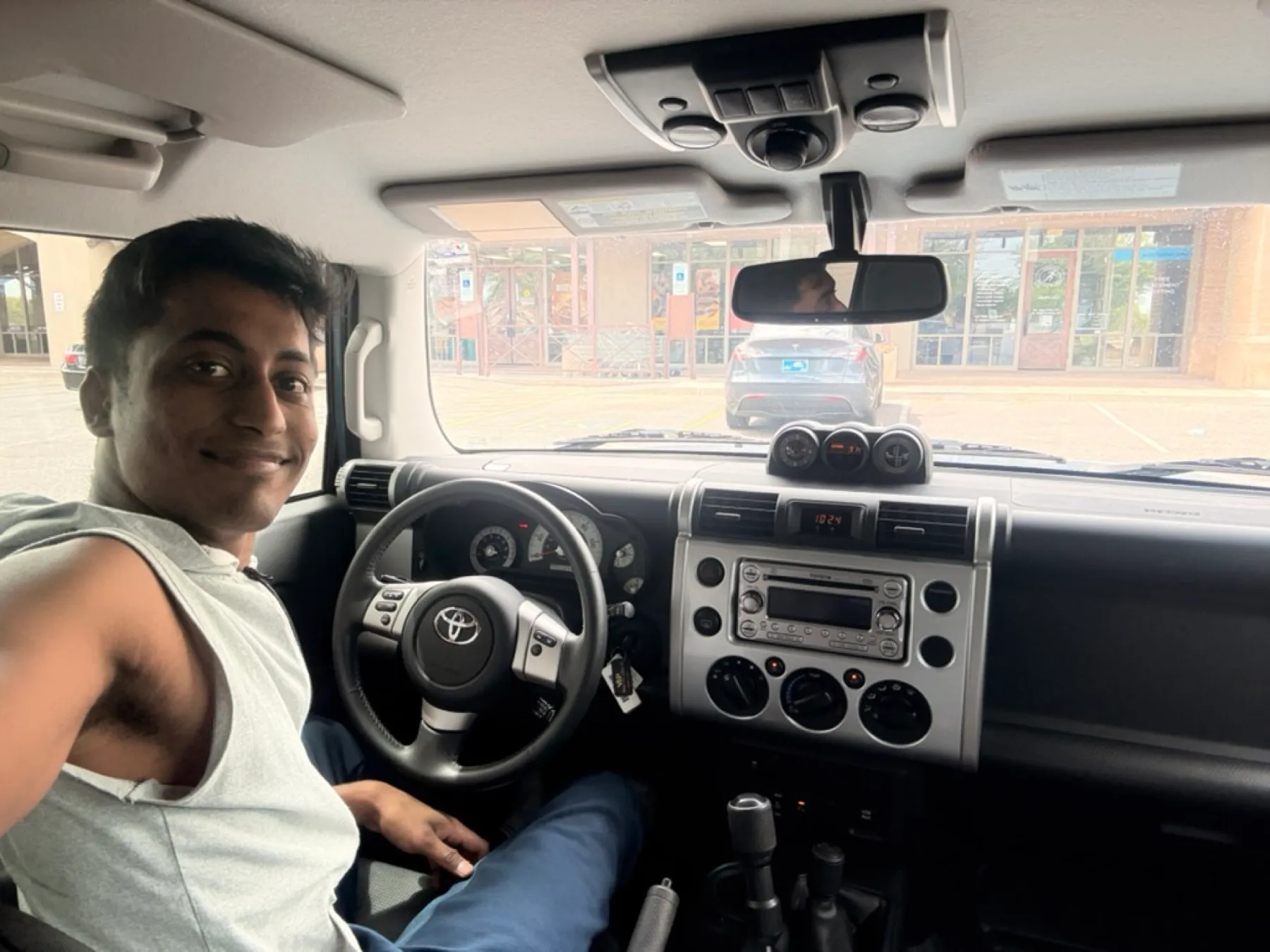 Sitting in the driver's seat of a Toyota FJ Cruiser